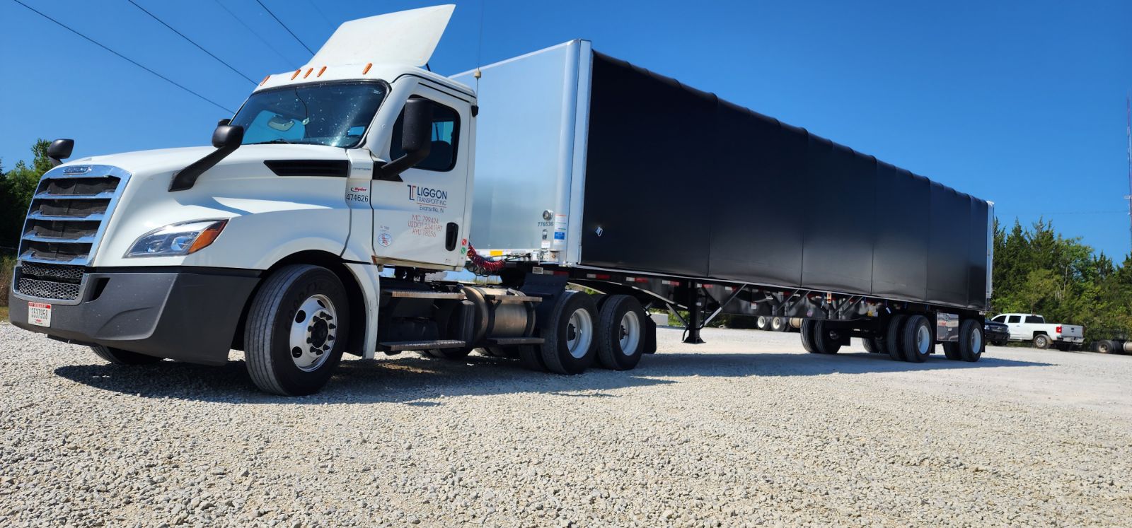 A large truck is parked on the side of the road.